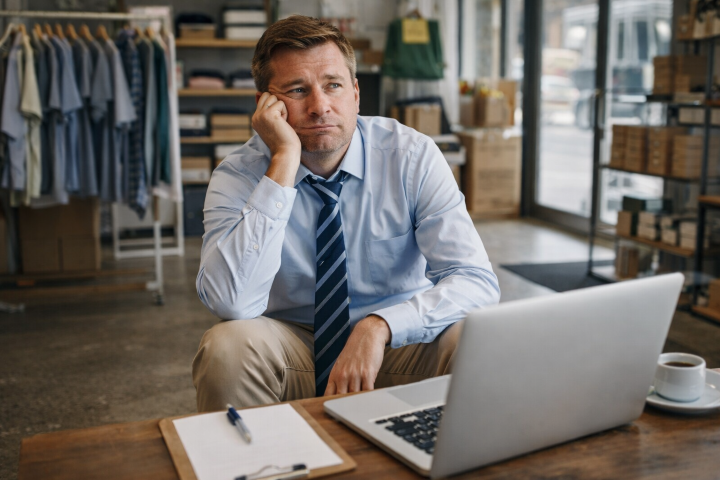 Business owner waiting for customer calls while looking at website results